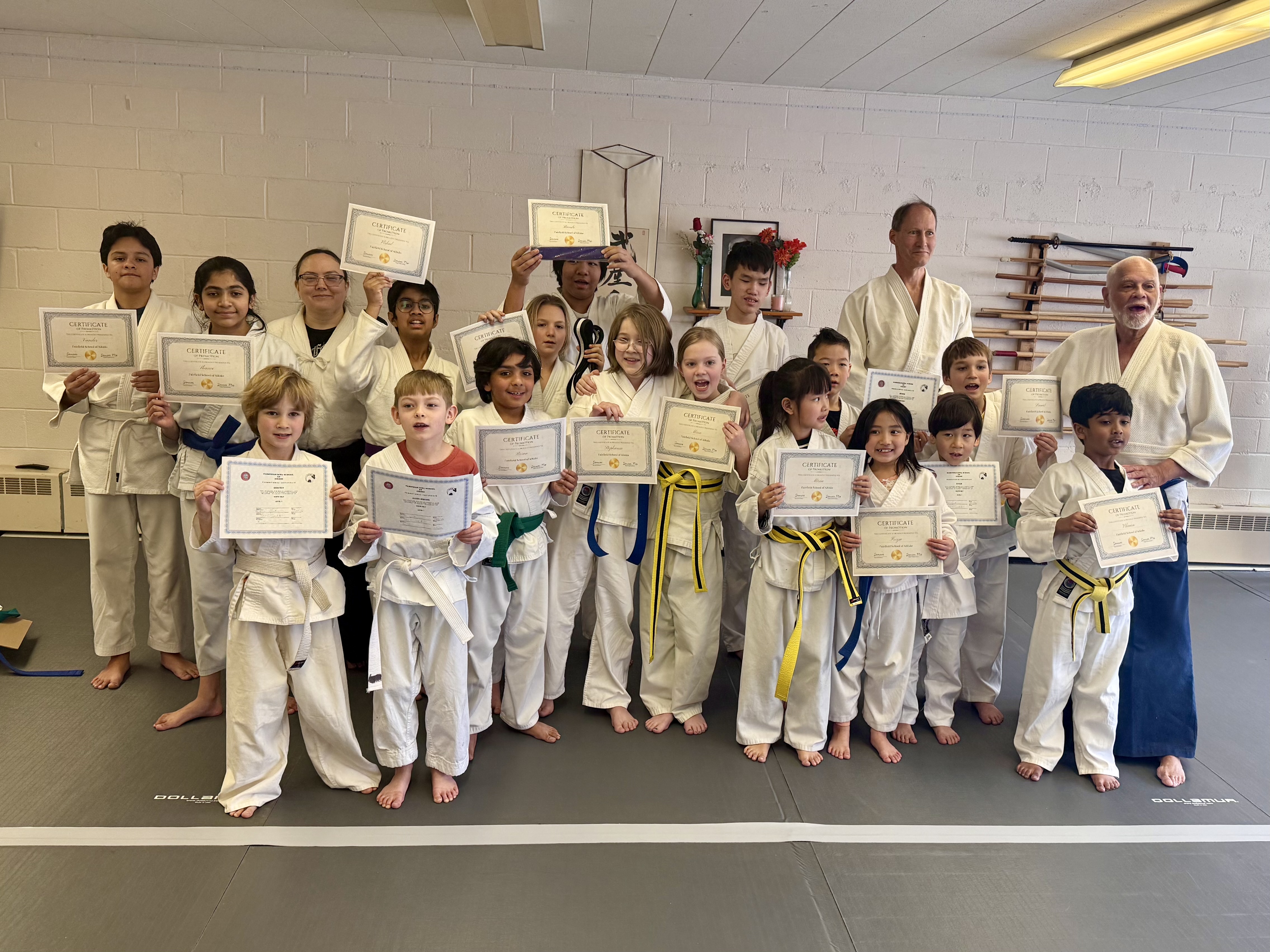 Group photo of students with rank certificates